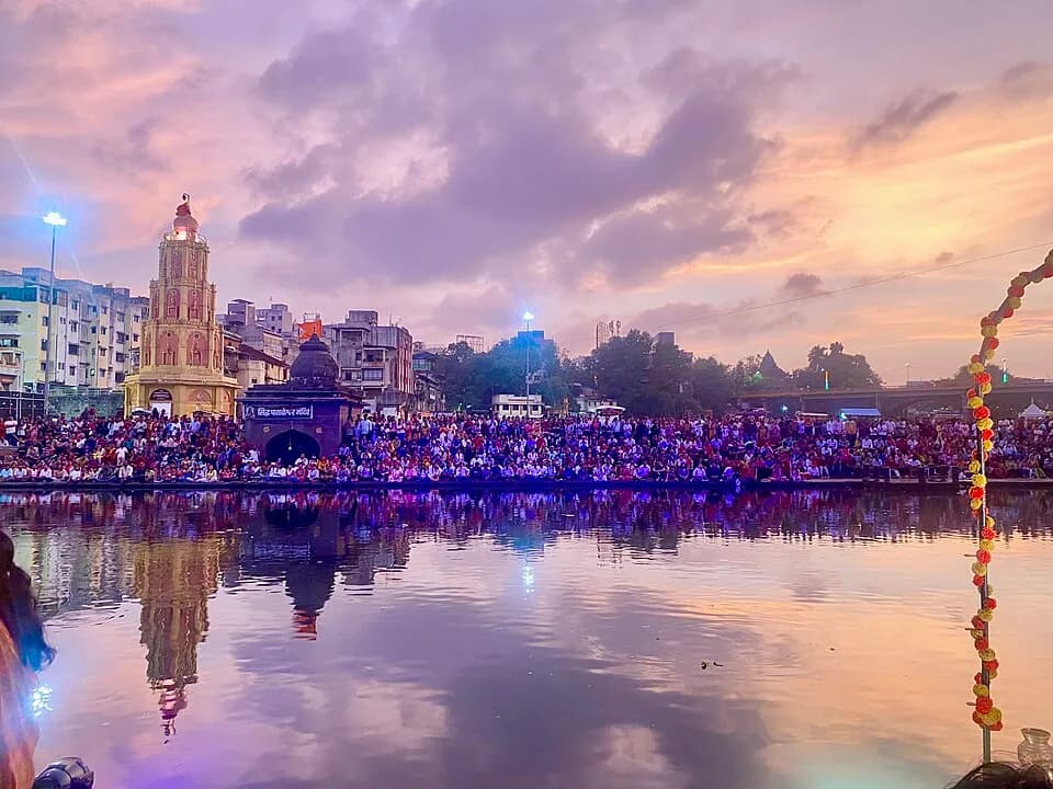 Evening at Ramkund, Nashik, with lights reflected in the Godavari river
