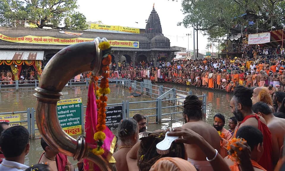 Sadhus and devotees crowding Kushavarta Kund in Trimbak